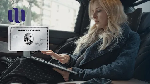 woman sitting in the backseat of a car using a tablet