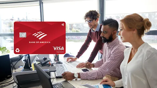 two men and a woman sitting talking in front of a computer evaluating the Bank of America Customized Cash Rewards Credit Card