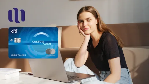 woman using a laptop with a focus on the Citi Custom Cash Mastercard